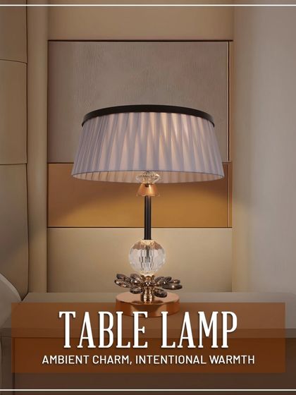 This elegant table lamp with a pleated shade and crystal base adds a touch of ambient charm and intentional warmth to any bedside table or console.