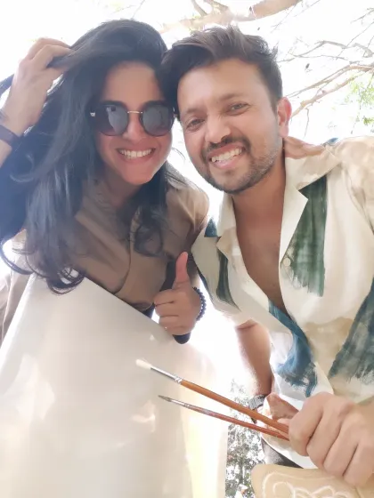 That's us, Varsha and Vivek, ready to paint at a bucket-list wedding. We're so excited to bring our passion for art to your big day.