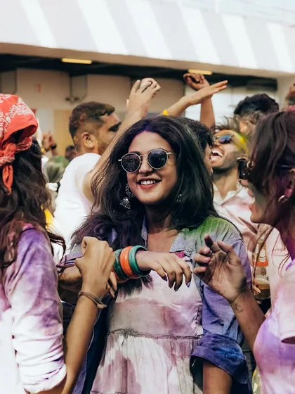 The candid joy of friends dancing together at our Holi celebration. These are the moments of connection we strive to create.