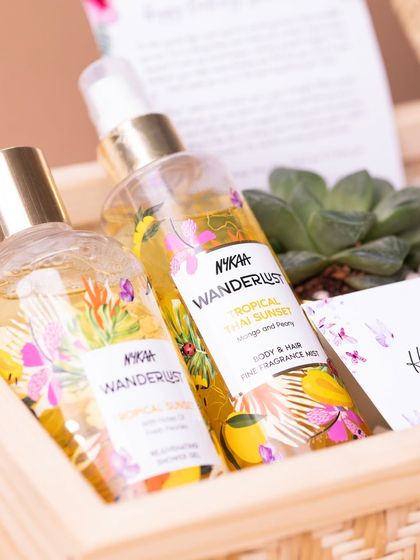 Nykaa Wanderlust 'Tropical Thai Sunset' body mist and shower gel, chosen for a tropical-themed birthday hamper to provide a sensory escape.