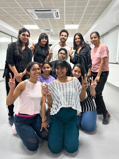 The weekend batch at Noida Stadium, all smiles and peace signs after learning a new routine.