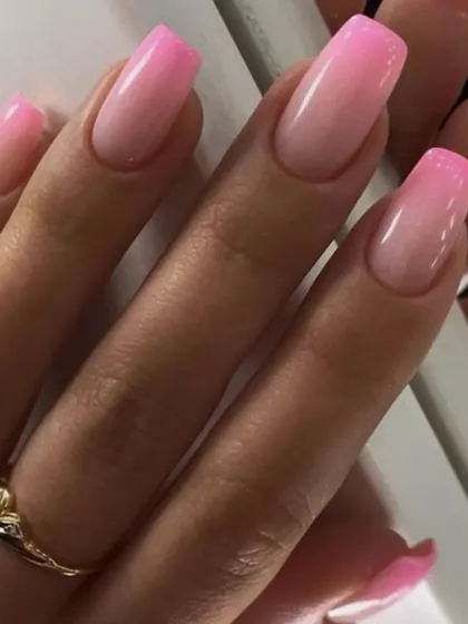 A vibrant pink ombre on coffin-shaped nails, showing a smooth transition from a light base to a bright, saturated pink.