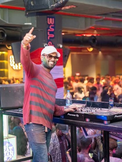 A great shot of me interacting with the Holi crowd from the DJ console. I'm always on the mic, making sure the energy stays high and everyone feels like part of the show.