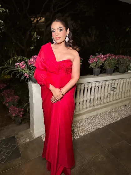 Sometimes I wear red. A personal photo of me in a bold red outfit, showcasing my own style and love for classic glamour.
