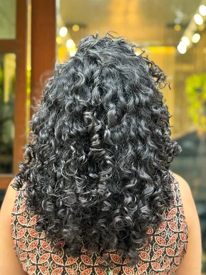 These smiles mean the world to me. I've been caring for this client's curls for two years, and it's been a joy to see her embrace her beautiful hair.