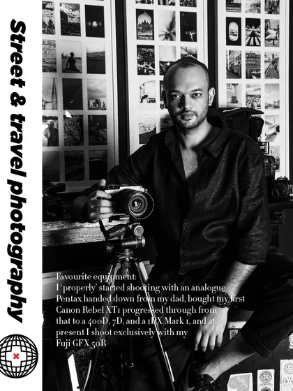 A black and white portrait of an artist in his studio, holding his camera. The image has text overlay explaining his journey.