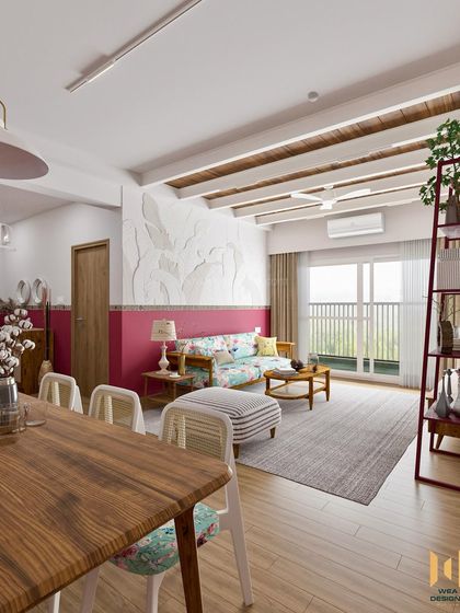 A perspective from the dining area, looking towards the living room with its unique 3D leaf-patterned wall art.