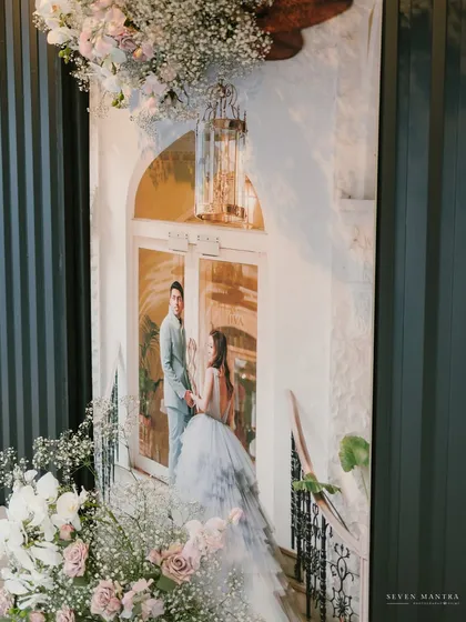 Bringing the outdoors in. For this reception, I incorporated a large-scale print from the couple's pre-wedding shoot, surrounding it with soft florals to create a personalized and romantic entrance piece.