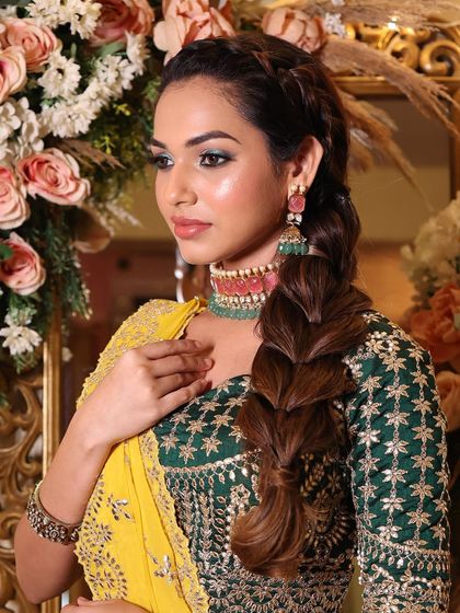 This look is daringly chic and classy. The captivating green eyeliner is the star of the show, adding a bold and modern twist to this mehendi or sangeet look.