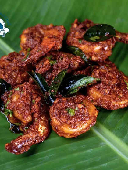 My Tawa Kokum Prawns are a culinary masterpiece. Served on a fresh banana leaf, these prawns are cooked with tangy kokum and a blend of coastal spices for an authentic and unforgettable taste.