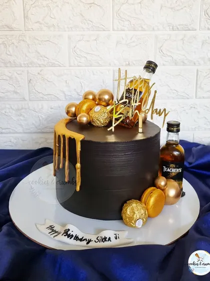 For those who appreciate a classic, this black and gold drip cake is a go-to. Decorated with miniatures, Ferrero Rocher, and macarons, it’s a sophisticated choice for any adult celebration.