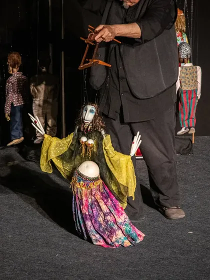A belly-dancing marionette from the Italian show 'Il Fil'armonico'. This non-verbal performance uses music and dazzling puppetry to tell a universal story about humanity and love.