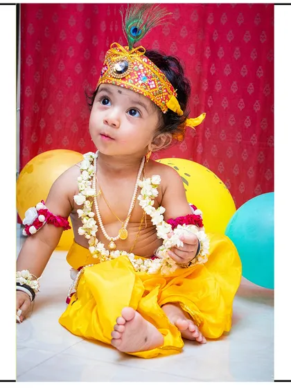 A classic pose from a 'Little Krishna' photoshoot. I guide children into gentle poses that fit the theme while capturing their natural curiosity.