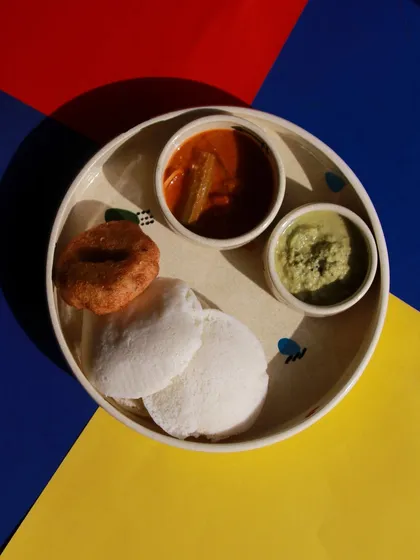 A complete South Indian breakfast thali set from the 'Playful Mornings' collection, featuring a large plate and small katoris for sambar and chutney.