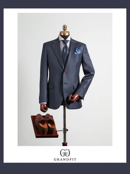 A slightly lighter blue suit offers a modern alternative for the boardroom. Paired with a patterned tie and pocket square, it demonstrates a confident approach to business attire.
