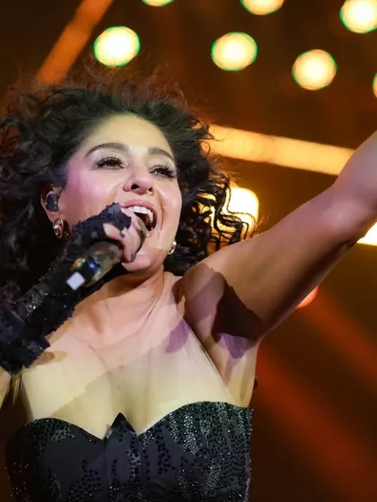 A powerful vocal moment captured up close, showing the passion she brings to every note.