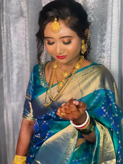 A closer look at Priyanka's reception makeup. The red lip is sharp and defined, and the eye makeup has a beautiful shimmer that catches the light.