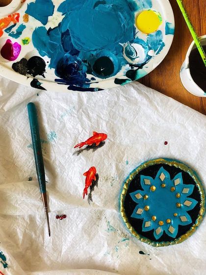 My little koi fish friends always find their way into my workspace. This photo captures a moment of play and experimentation with 3D painting and Lippan art elements.
