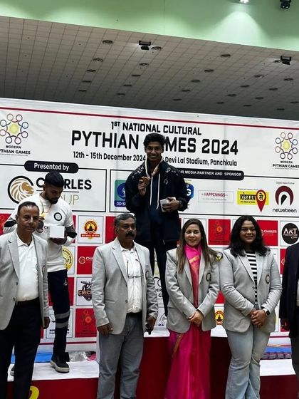 A gold medal win for our fighter at the Pythian Games. This is a testament to his skill and dedication.