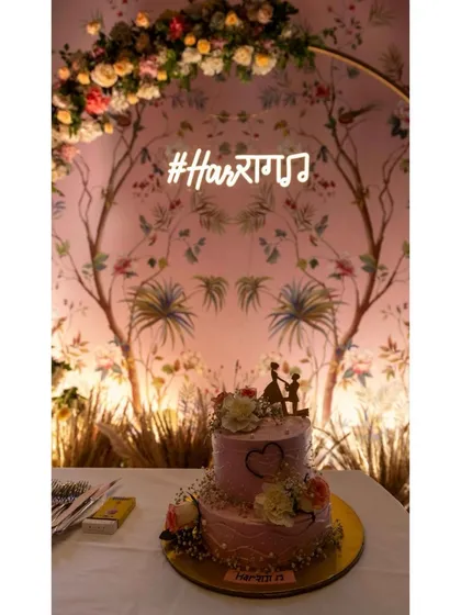This two-tiered cake was part of a beautiful event, fitting perfectly with the floral decor and custom neon sign. I love making cakes that complete your celebration's aesthetic.