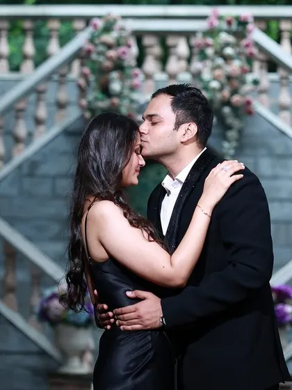 An intimate moment captured as the groom kisses the bride's forehead during their pre-wedding shoot.