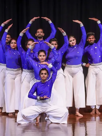 A full cast shot of our talented dance troupe for the 'KALKI' production. We pride ourselves on training a large group of individual dancers to move as one cohesive unit, creating a powerful and unified stage presence.