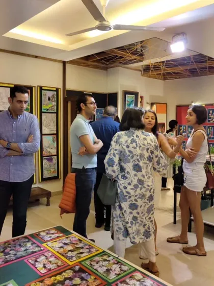 The exhibition showcases a wide variety of art, from paintings on the wall to decorated objects on display tables. It is a true reflection of the many skills our students learn.