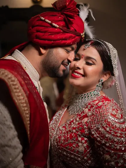 A romantic close-up of a bride and groom, their faces close, capturing the intimacy and happiness of their wedding day.