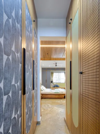 The walk-through wardrobe space in the Villa 17 master bedroom. We used different textures and patterns on the teak-framed shutters to add visual interest.