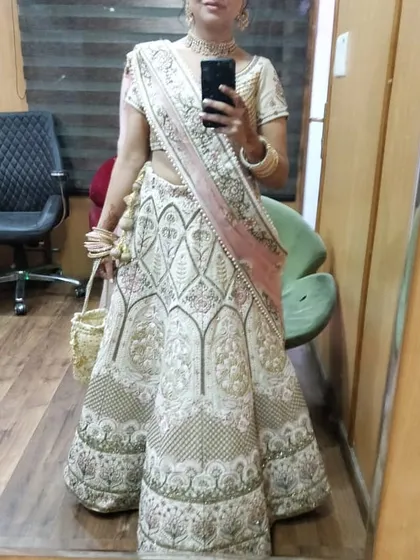 A mirror selfie from a client trial, showing the full lehenga. This gives a realistic idea of the outfit's appearance before professional styling, highlighting its inherent beauty.