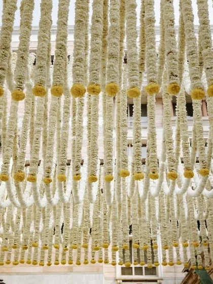 A look at the ceiling, made from thousands of hand-strung jasmine flowers creating a beautiful scalloped pattern.