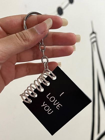 A simple "I Love You" message on the cover of a mini booklet keychain.
