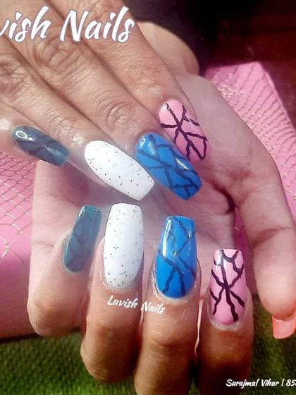 A colorful and abstract set with a mix of patterns, including spider-gel art and speckles.