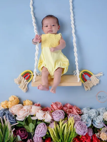 A full view of the floral swing setup, showing the creative and dreamy scenes I can build for your newborn's photoshoot.