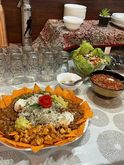 Setting up a healthy and satisfying meal. This gives you a better look at the balanced nacho bowl, perfect for a main course that supports a lean muscle diet without sacrificing flavor. You can see the fresh salad and salsa served alongside.