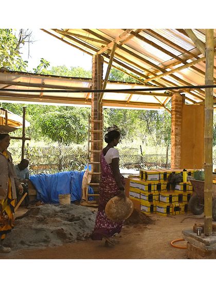 Inside the workshop at Cheerville. This is where our team of women masons prepares materials, mixes mud, and brings our sustainable designs to life.