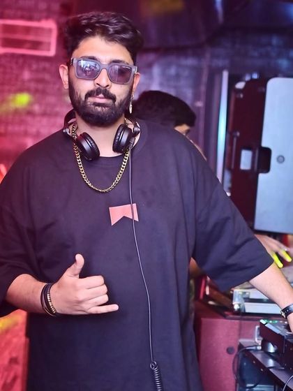 A confident pose at the DJ booth during ladies' night at Tipsy Bull.