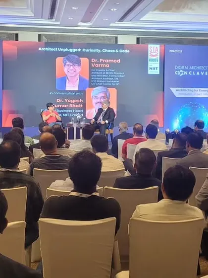 A live panel discussion in progress at the Digital Architect Conclave. This shot shows a fully engaged audience and our seamless on-stage production, including the main LED screen and side panels for branding.