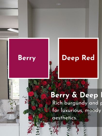 This wall installation of deep red and berry-toned roses creates a luxurious and moody aesthetic, perfect for a dramatic interior statement.