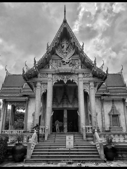 The stunning architecture of Wat Chalong Temple in Phuket, Thailand. Our international trips include deep dives into local culture and heritage.