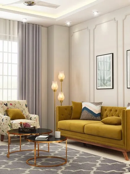 This wider view of the living room design shows the complete furniture arrangement, including two floral-print armchairs that add a touch of traditional charm to the modern setting.