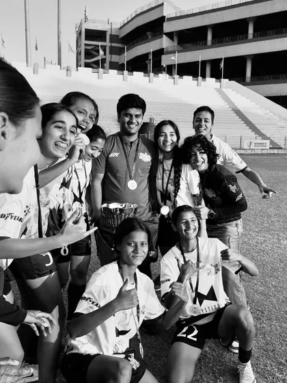 Candid joy. The team sharing a laugh after their win, a testament to the strong bonds forged through shared struggle and success.