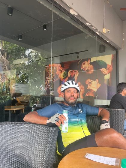 A rider relaxes at a Starbucks during the Jog Falls 1000K BRM. Even on the toughest rides, there are moments to refuel and recharge, whether it's at a local dhaba or a modern cafe.