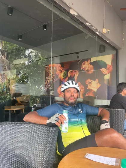 A rider relaxes at a Starbucks during the Jog Falls 1000K BRM. Even on the toughest rides, there are moments to refuel and recharge, whether it's at a local dhaba or a modern cafe.