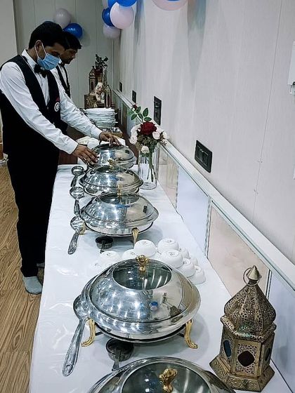 My staff setting up for a corporate catering event for 50 people near Galleria Market, DLF Phase 4. I ensure every detail is perfect before the guests arrive.