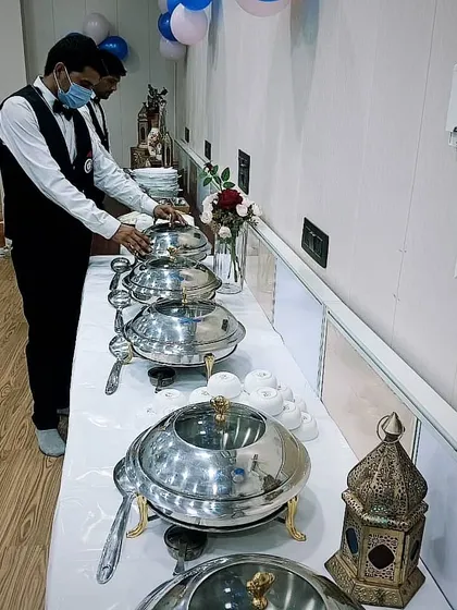 My staff setting up for a corporate catering event for 50 people near Galleria Market, DLF Phase 4. I ensure every detail is perfect before the guests arrive.