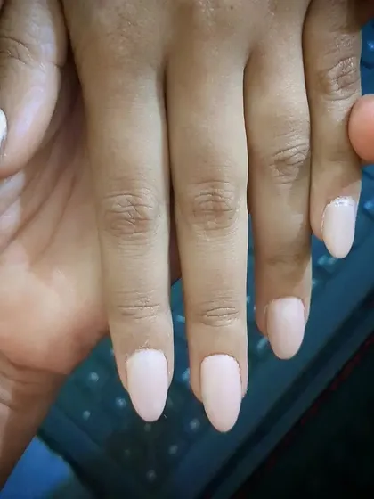 Sometimes, a simple, solid color is all you need. Here is a set of beautifully shaped almond nail extensions in a classic nude pink, perfect for a professional and polished everyday style.