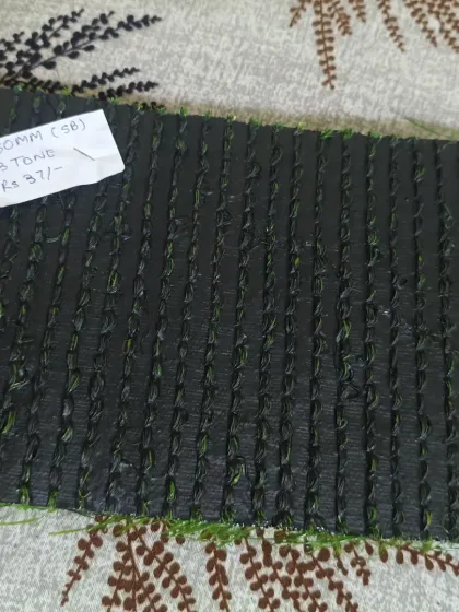 This is the single backing (SB) on a 50mm turf. Single backing is a lighter, more flexible option suitable for decorative areas, walls, or places with less foot traffic.