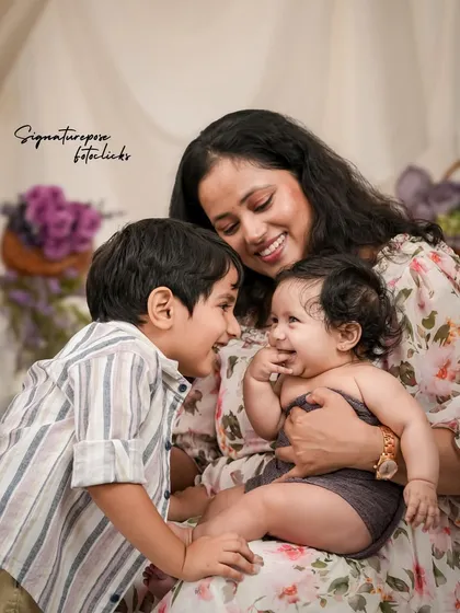 A family is a story of love. We focus on capturing those unscripted, joyful interactions, like this moment between a mother, her son, and their newest family member, creating memories that feel as warm as the hug itself.