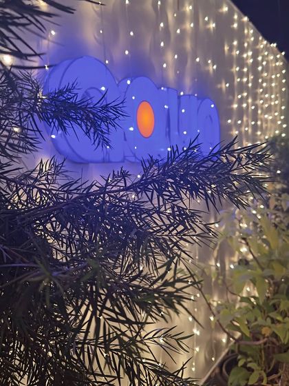 The Aqua logo glows against a wall of festive lights. We love to celebrate festivals like Deepawali and create a special ambiance for our guests.